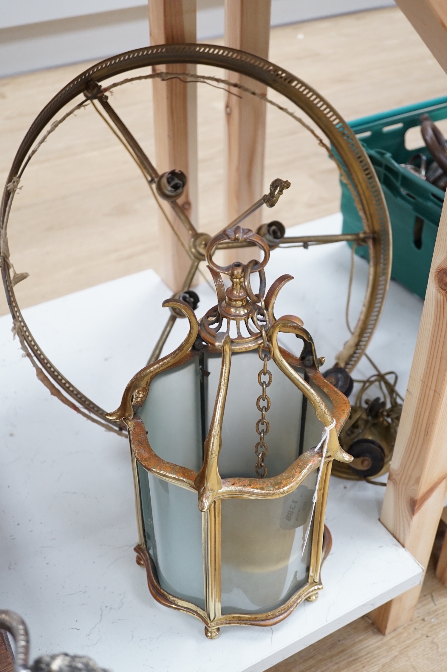 A brass hall lantern and a circular brass ceiling light fitting, hall lantern 40 cms high.